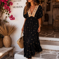 Elegant viscose dress in black with gold embroidery