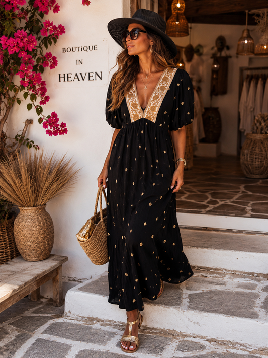 Elegant viscose dress in black with gold embroidery
