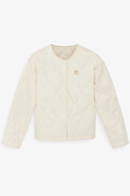 Gewatteerde damesjas met bloembroche