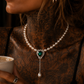 Black statement necklace with double ring pendant