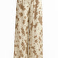 Damesbroek met wijde pijpen en print in beige – zacht en soepel vallend
