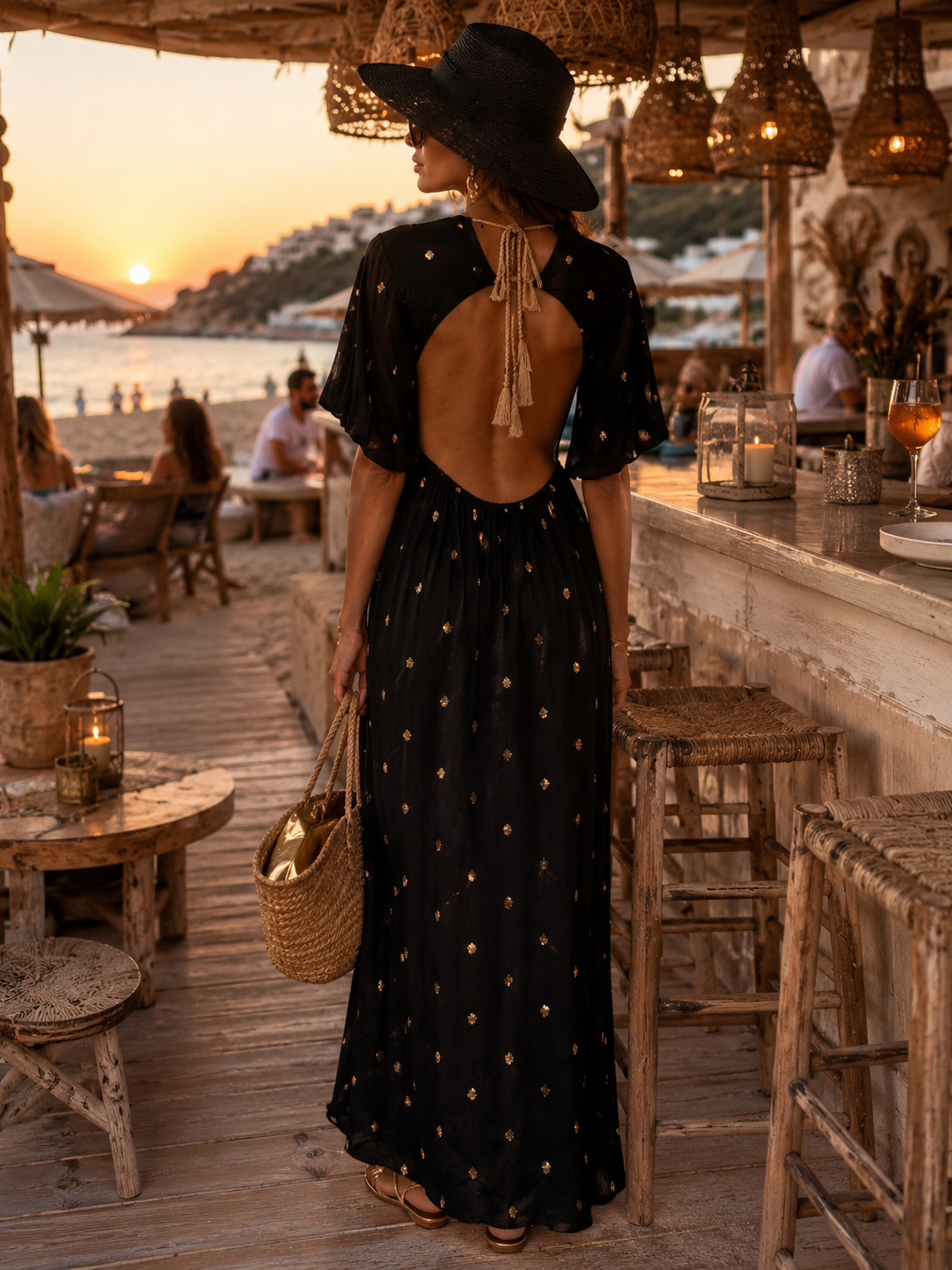 Elegant viscose dress in black with gold embroidery