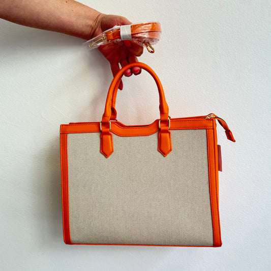 Leuchtend orangefarbenen Handtasche